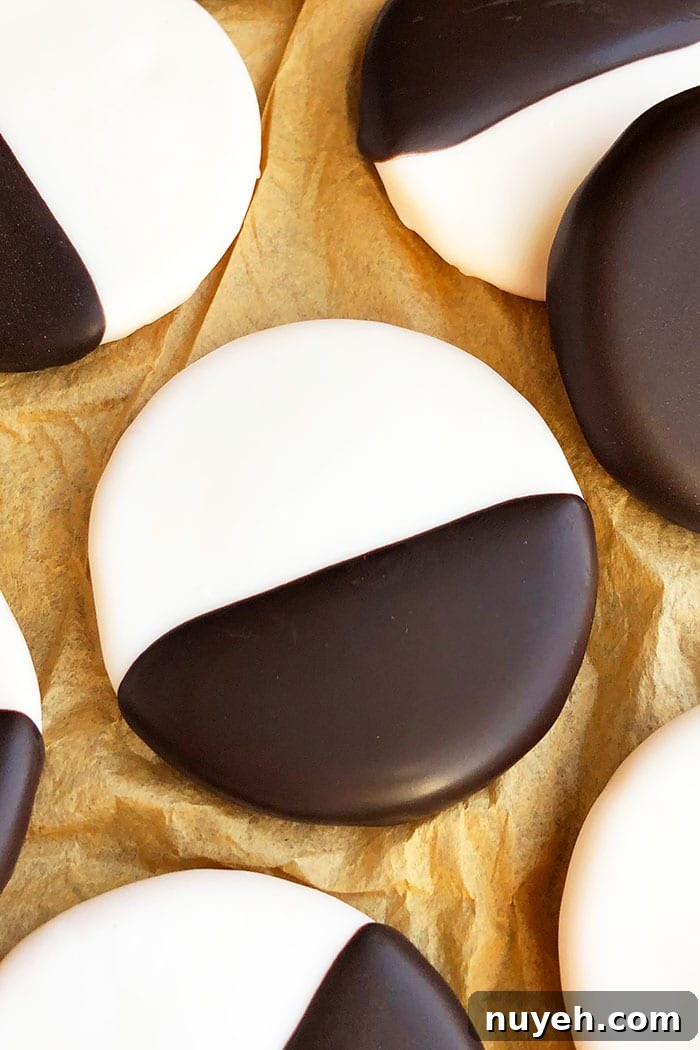 Closeup Shot of Single NYC Black & White Cookie On Brown Paper 