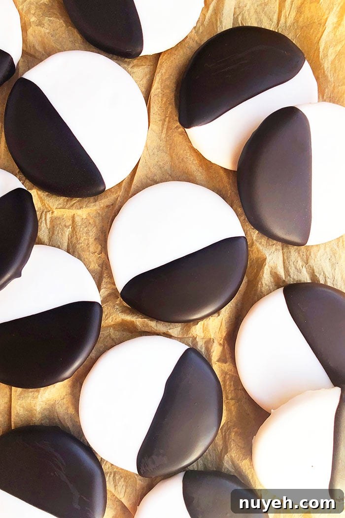 Lots of Black and White Cookies Spread Out On Brown Paper- Overhead Shot