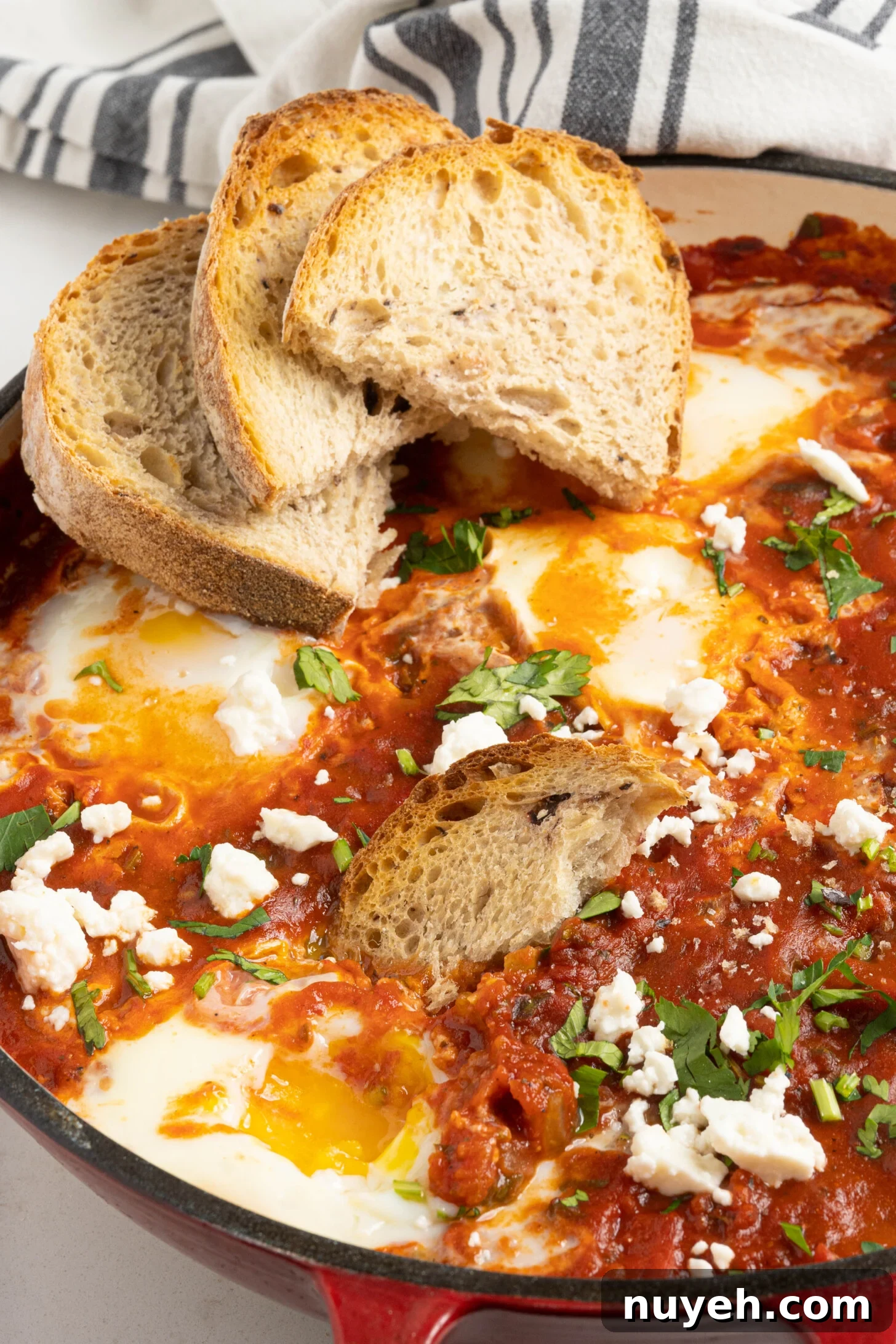 shakshuka in a pan with bread