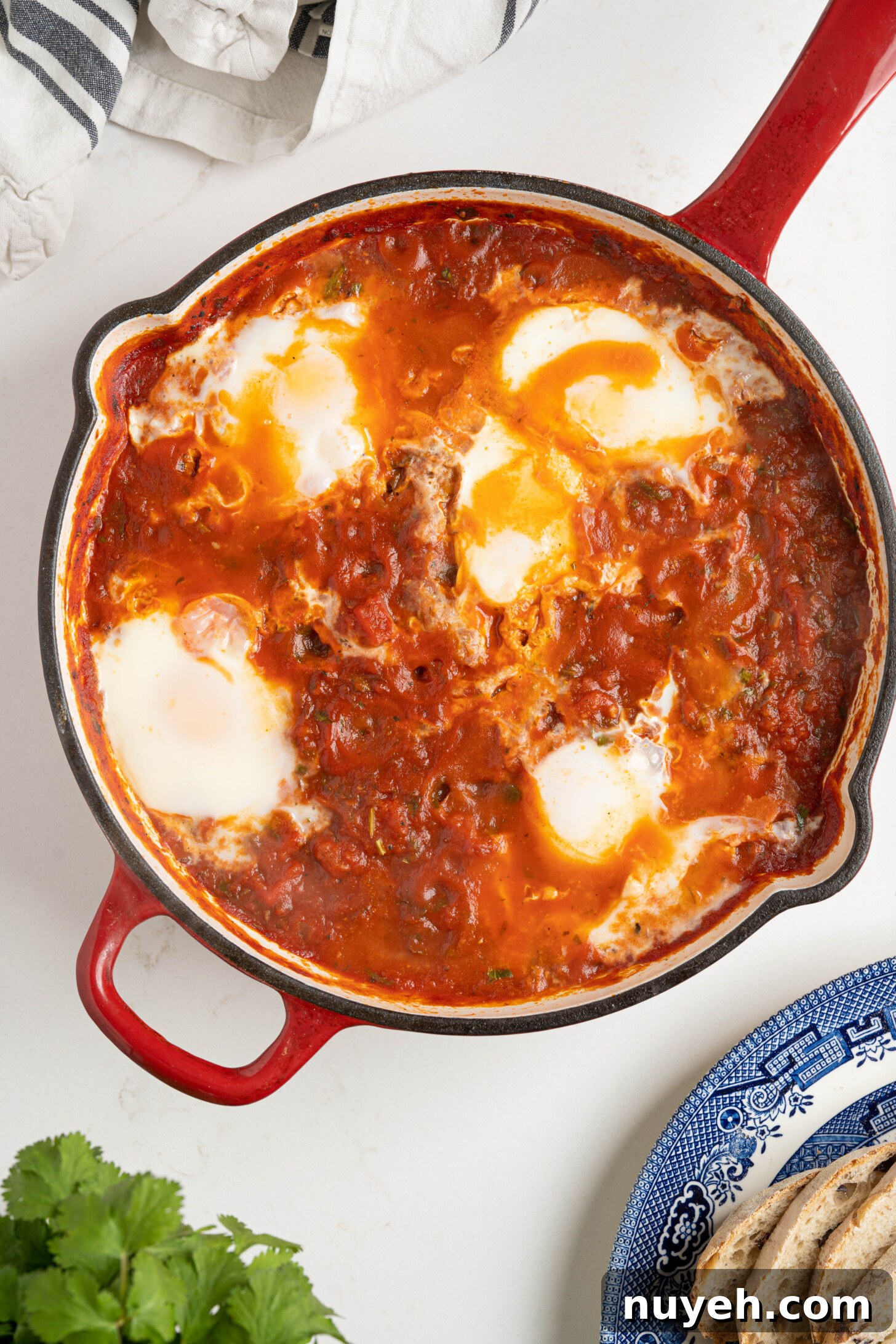 shakshuka in a pan on a white counter