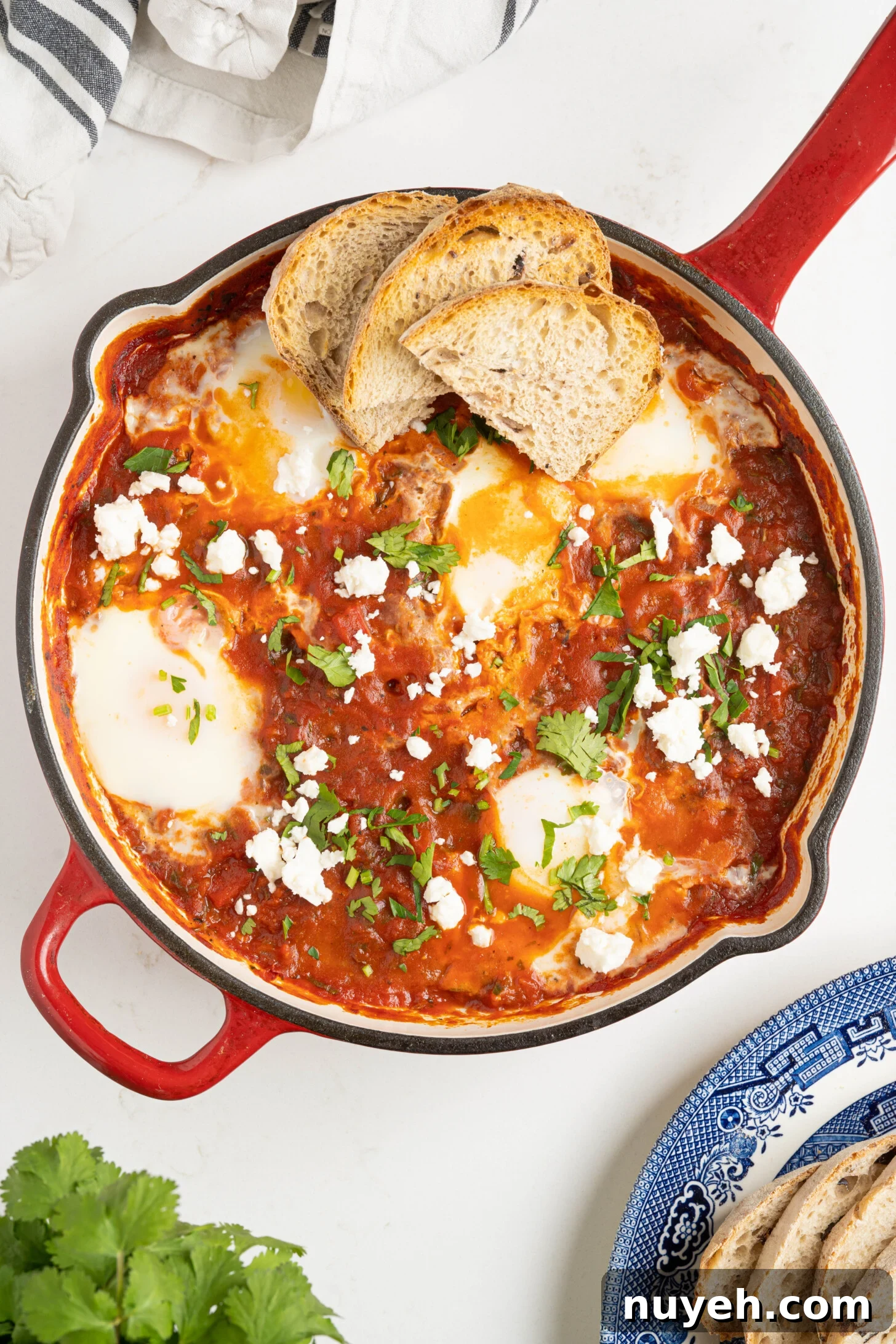 shakshuka in a pan on a white counter