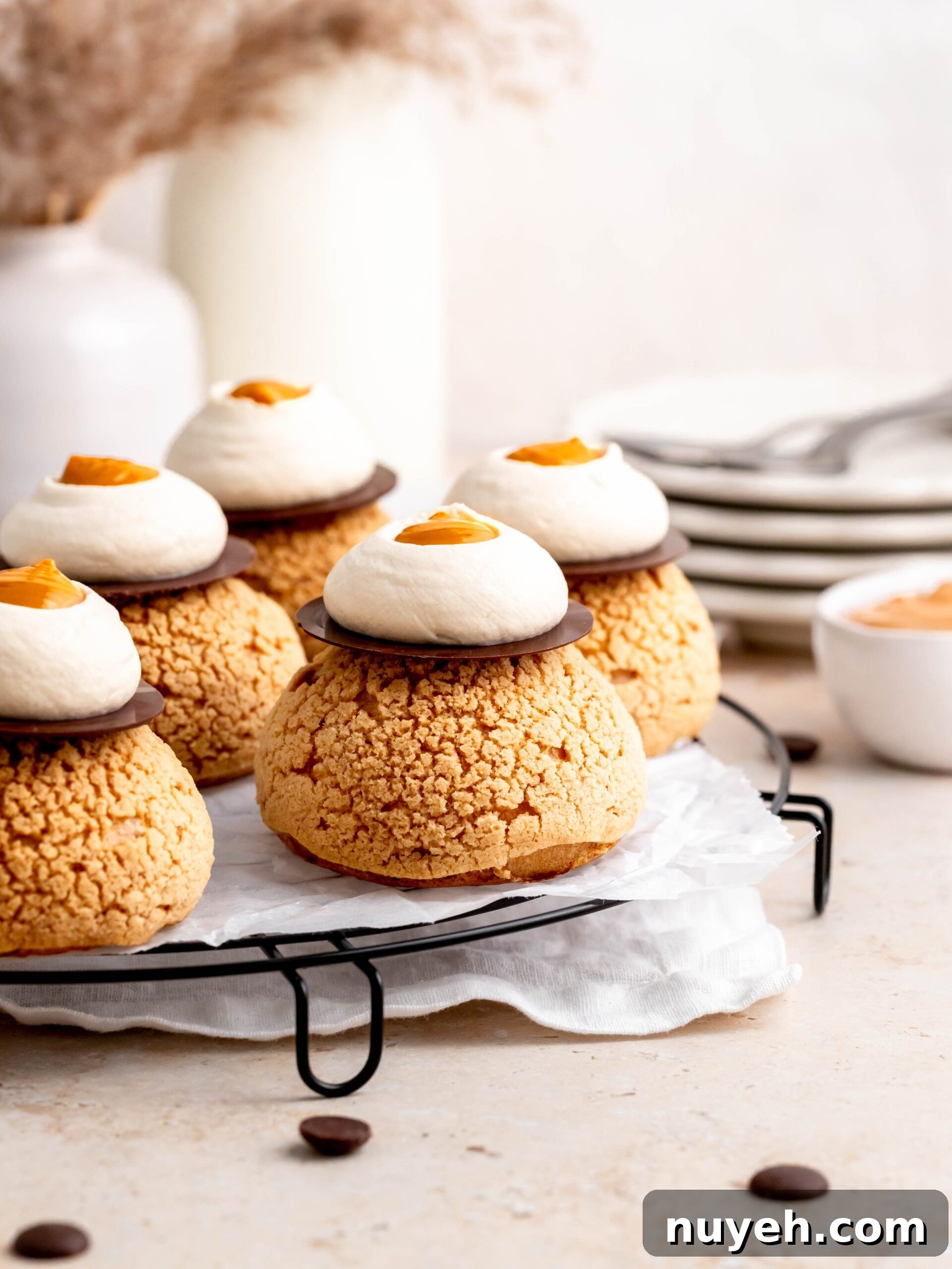 Choux au Craquelin with Coffee and Salted Dulce de Leche on a tray.