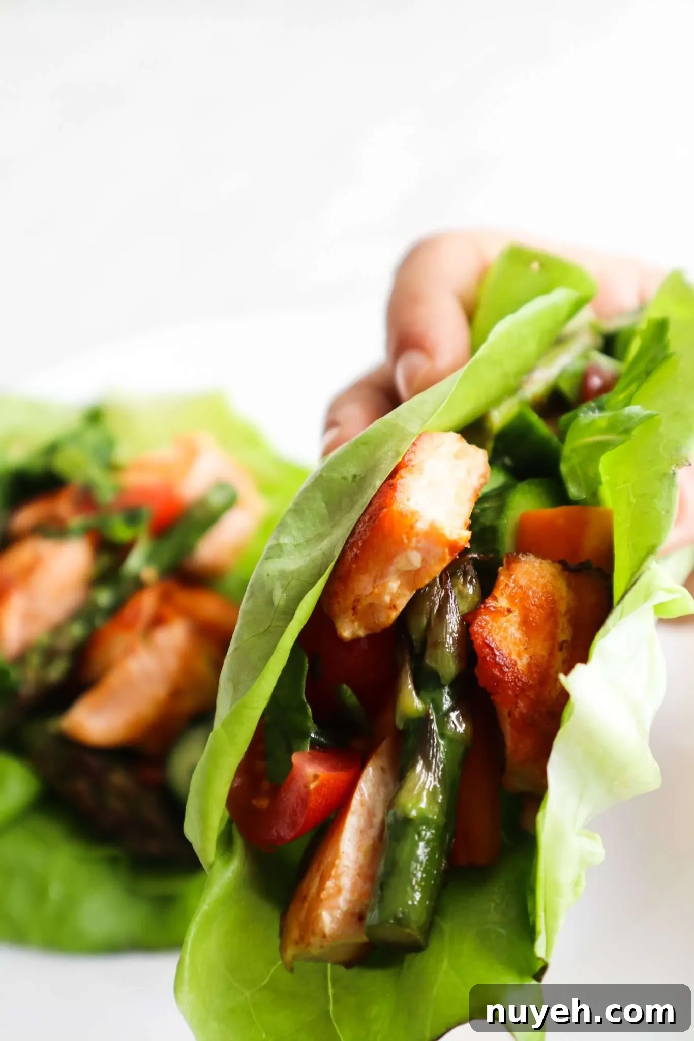 Healthy salmon lettuce wraps! This clean eating recipe is the perfect flavorful and delicious low carb dinner idea.