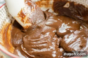 Melting milk chocolate and stirring the mixture together