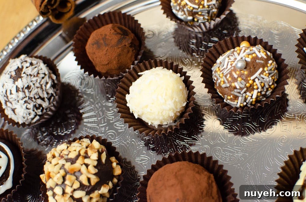 Milk chocolate truffles in paper cases served on a metal tray