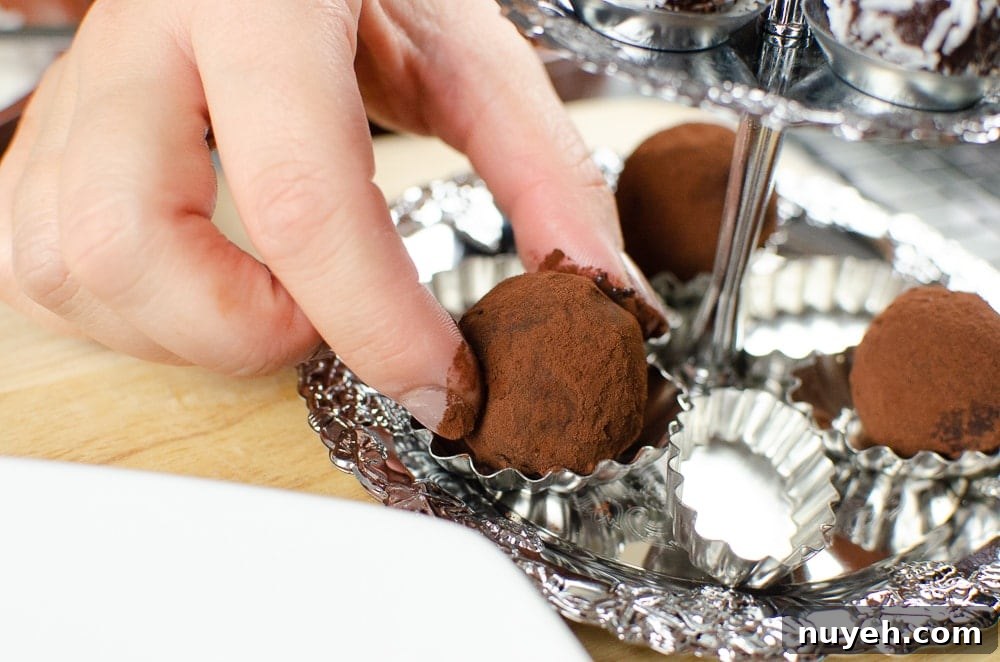 Placing our milk chocolate truffles on a silver serving tray