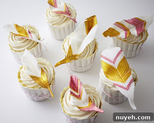How to Make Cupcakes with Edible Gold Feathers 2 DIY Gold Feather Cupcakes | a cake tutorial by Cakegirls for TheCakeBlog.com