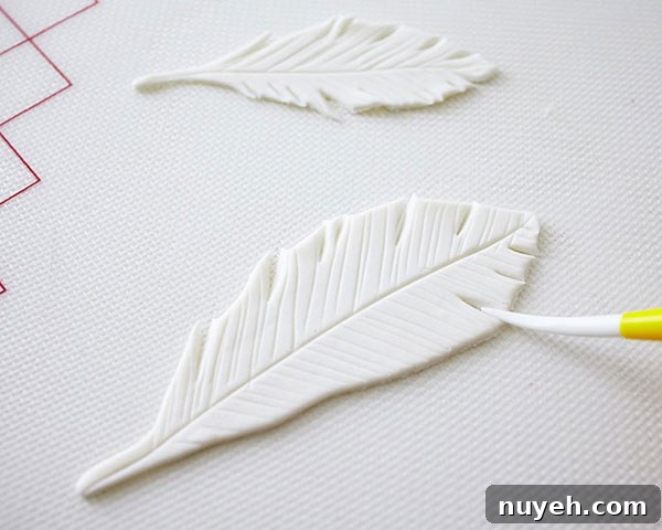 How to Make Cupcakes with Edible Gold Feathers 7 DIY Gold Feather Cupcakes | a cake tutorial by Cakegirls for TheCakeBlog.com