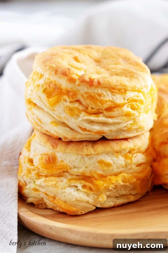 The final shot of three jalapeno cheddar biscuits on a plate.
