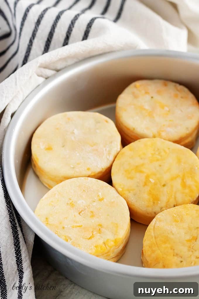 Unbaked biscuits in a pan.