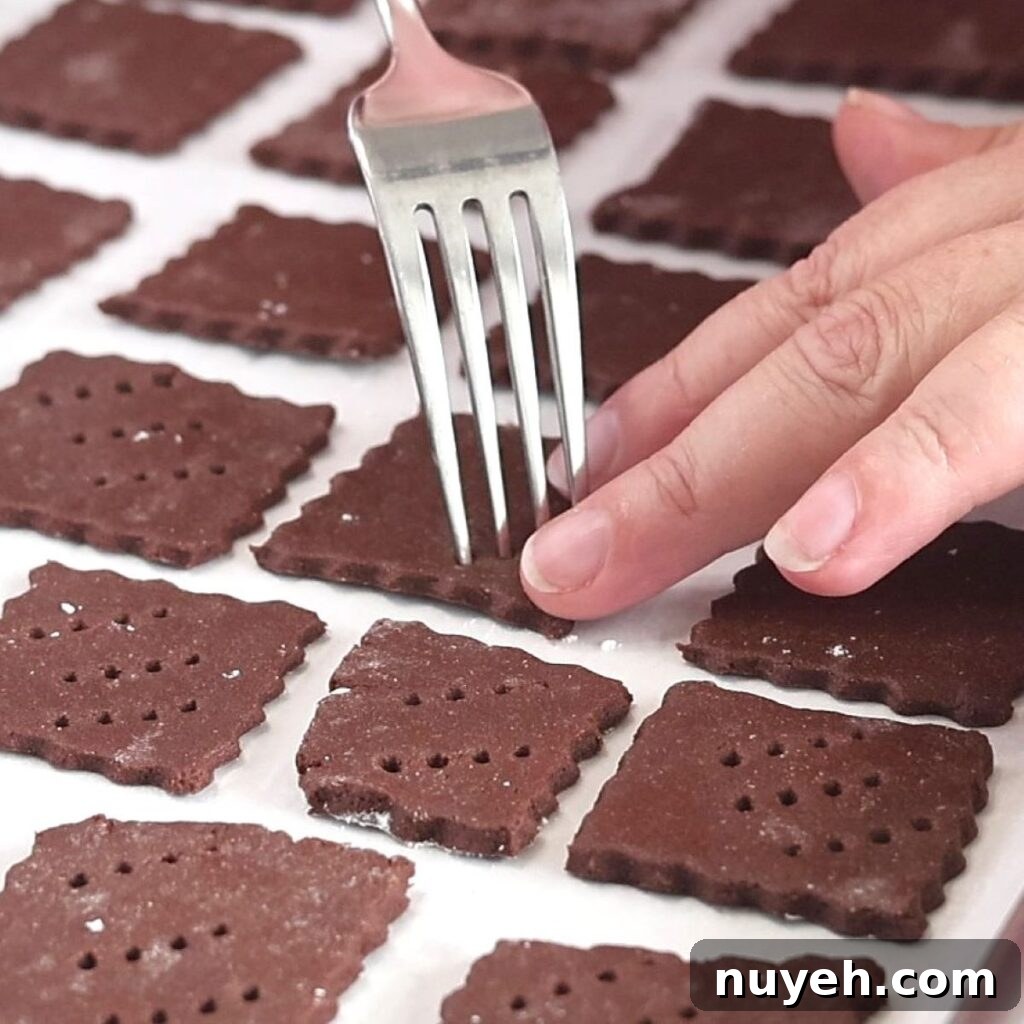 docking chocolate cookies with fork.