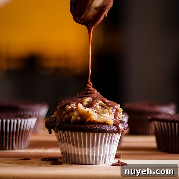 Drizzling chocolate ganache over the top of a German Chocolate Cupcake