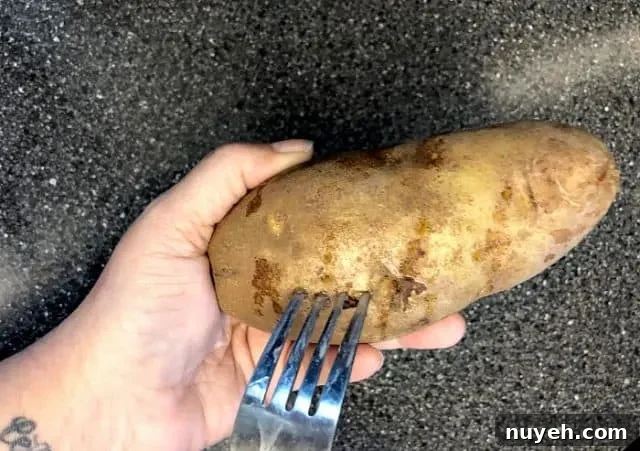 Piercing a potato with a fork