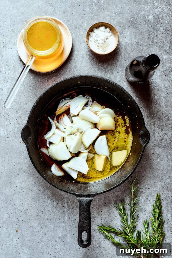 Cooking onions in melted butter in a skillet.