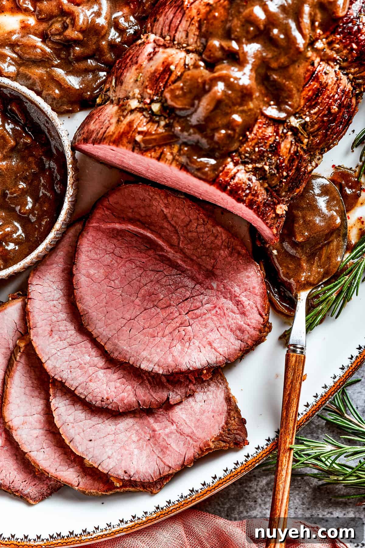 Close-up image of a sliced top round roast.