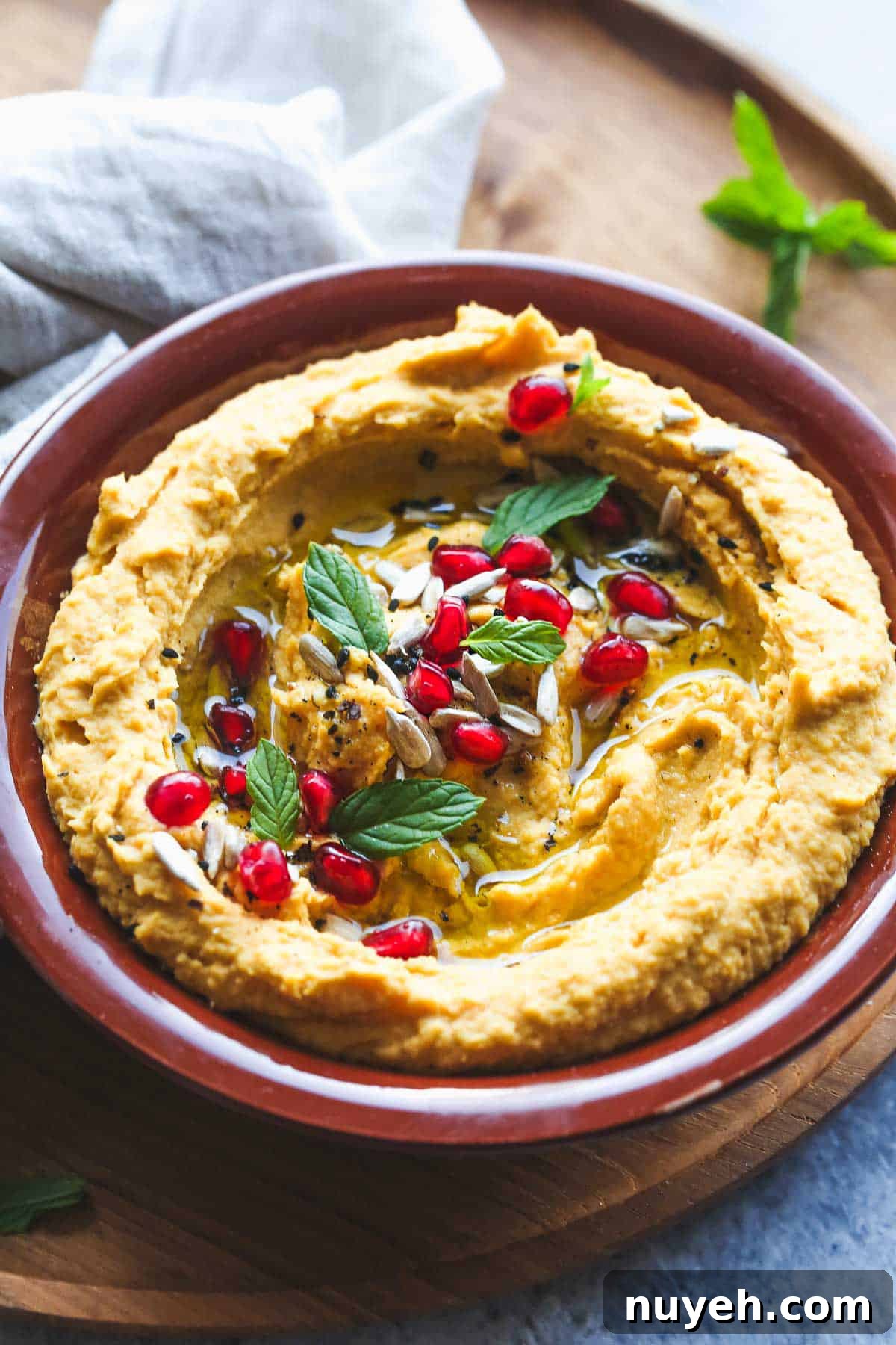 Sweet potato hummus in a brown bowl