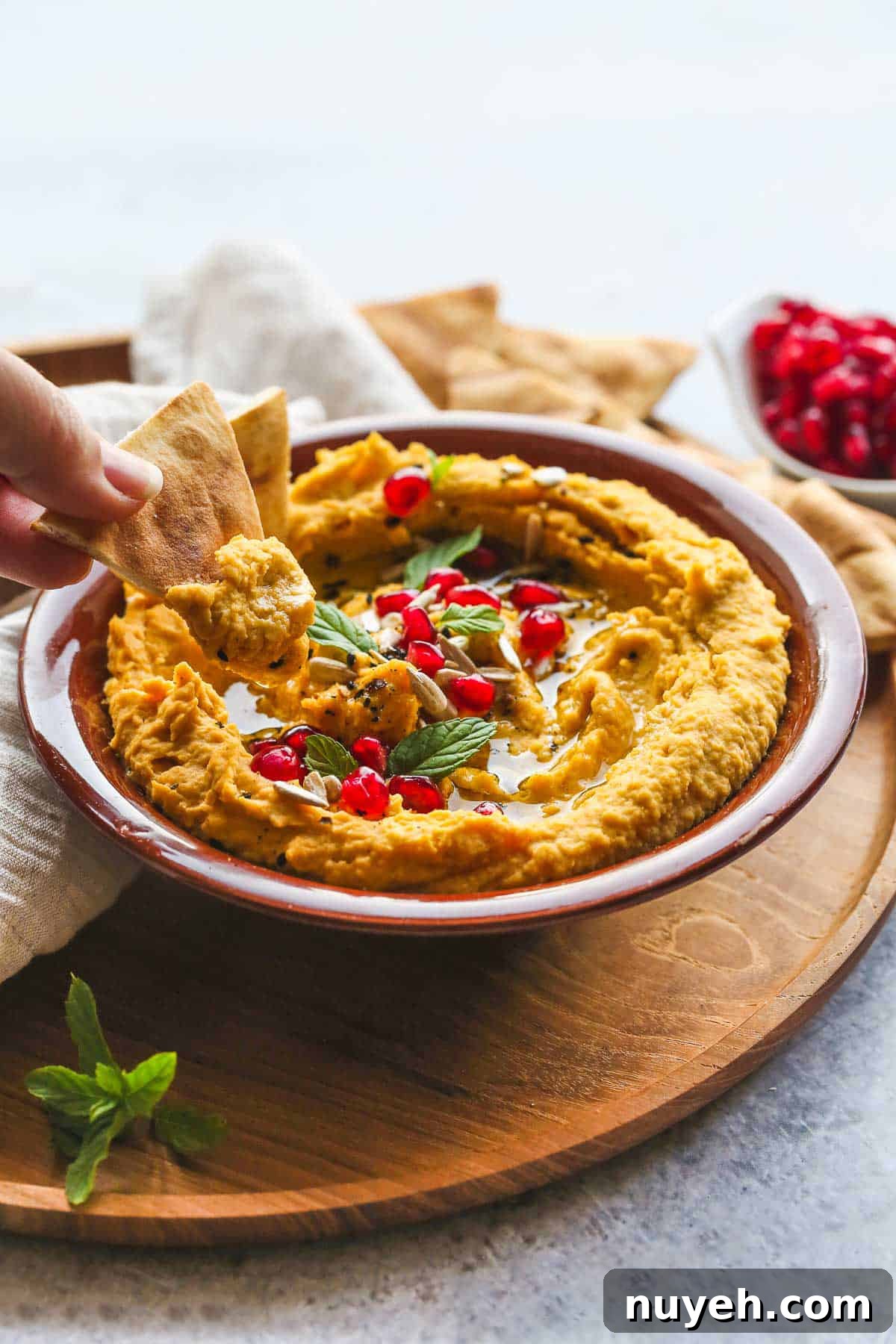 Eating sweet potato hummus with pita chips