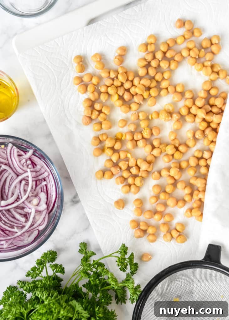 drying chickpeas between paper towels before adding them to the salad.