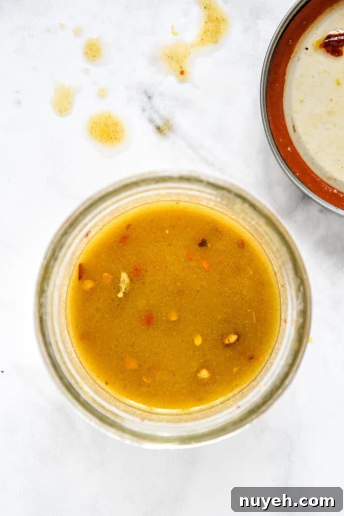 lemon oil dressing in a glass mason jar.