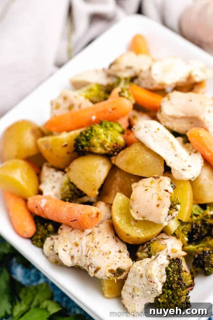 An up-close view of meat and veggies on a plate.