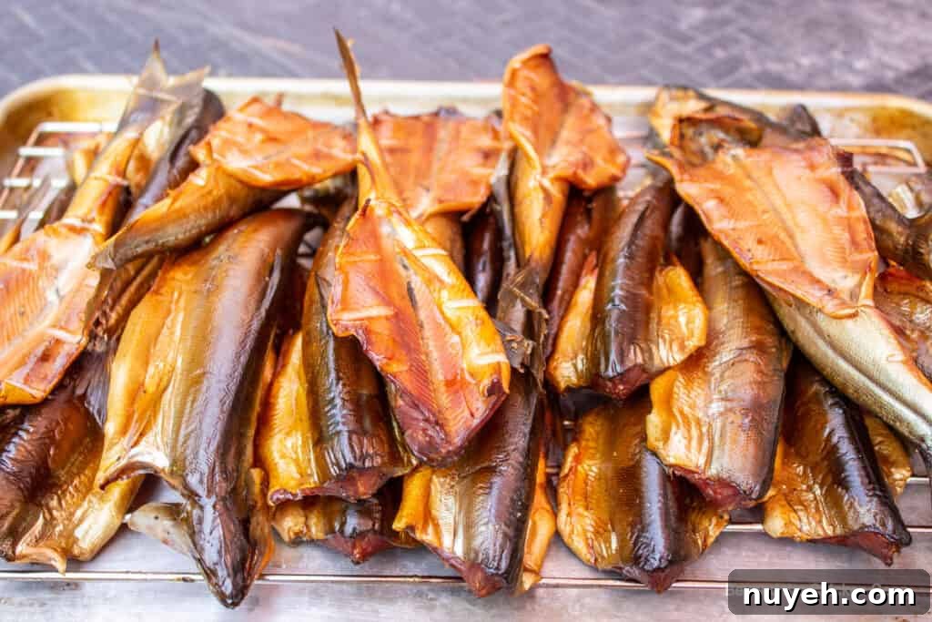 Smoked fish on a wire rack.