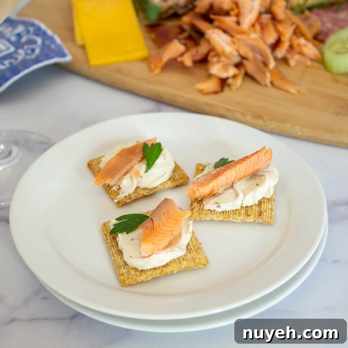 Smoked salmon on crackers with cream cheese.