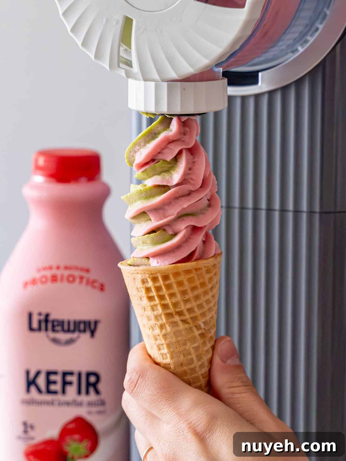Swirling matcha and strawberry ice cream out of a Ninja Creami Swirl.