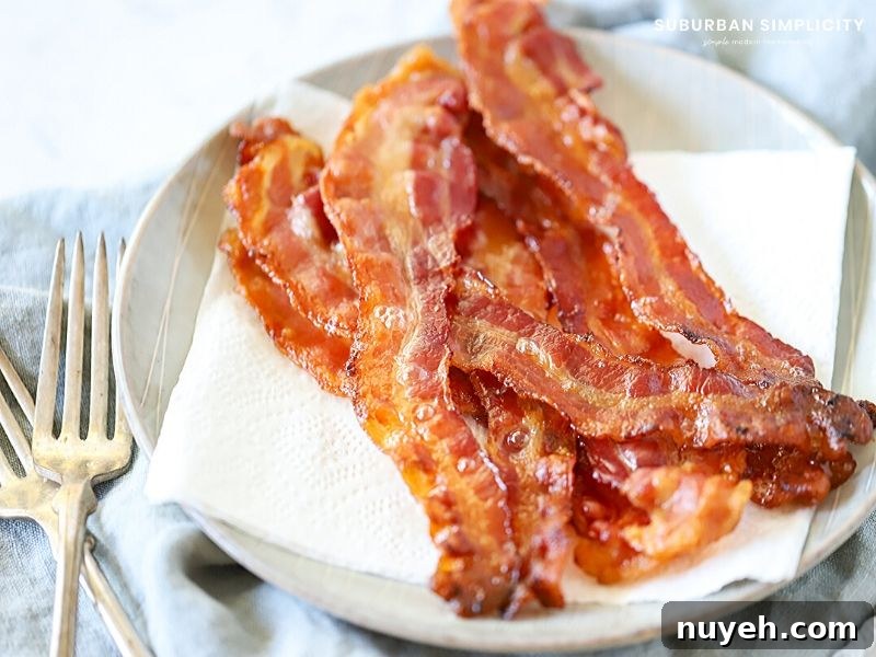 Cooked bacon on a plate.
