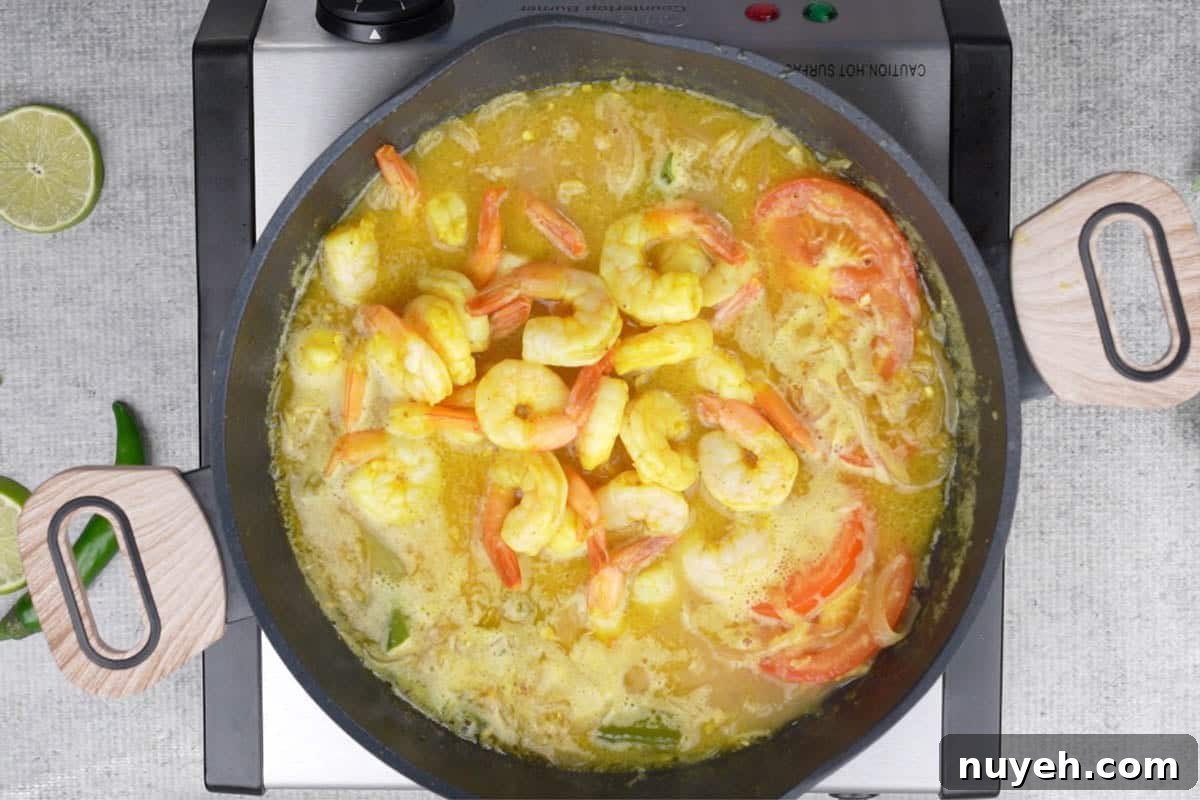 Fried shrimp added to the pan.