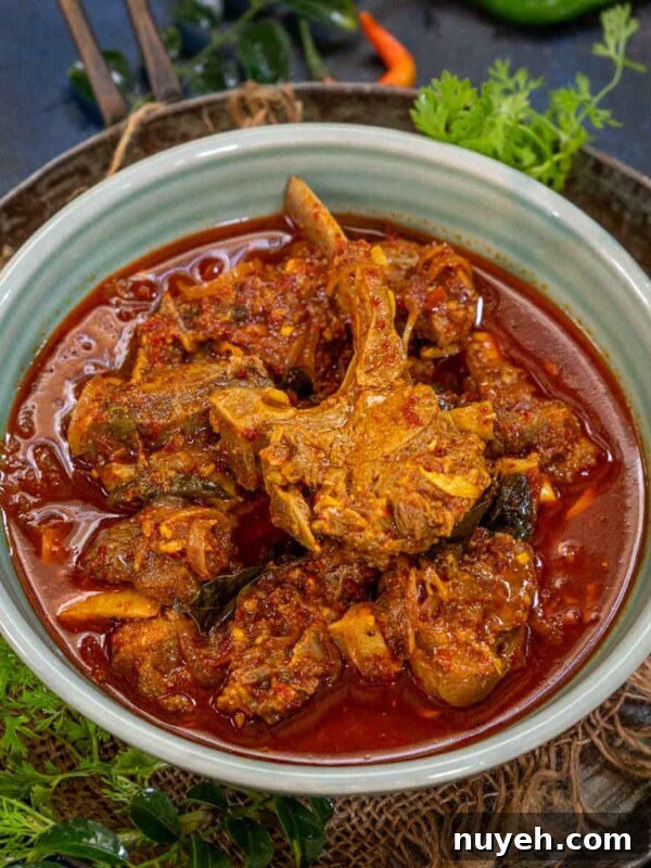 Kerala Style Mutton Curry served in a bowl.