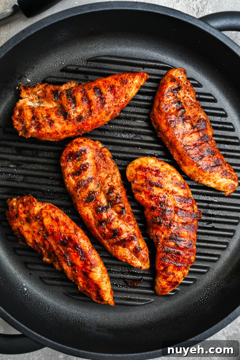 Crisp Chopped Chicken Salad with Feta and Lemon Vinaigrette 6 5 generously seasoned chicken tenderloins sitting on a large grill pan