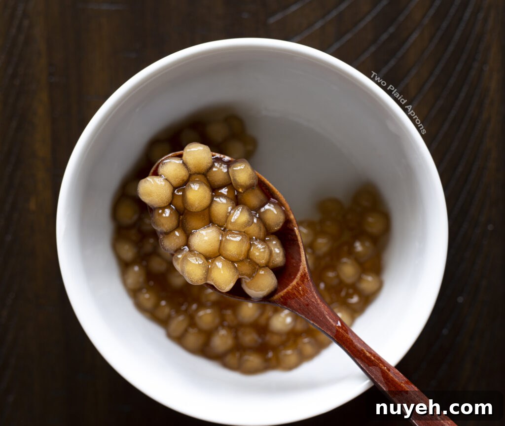 Rinsed cooked boba on a spoon.