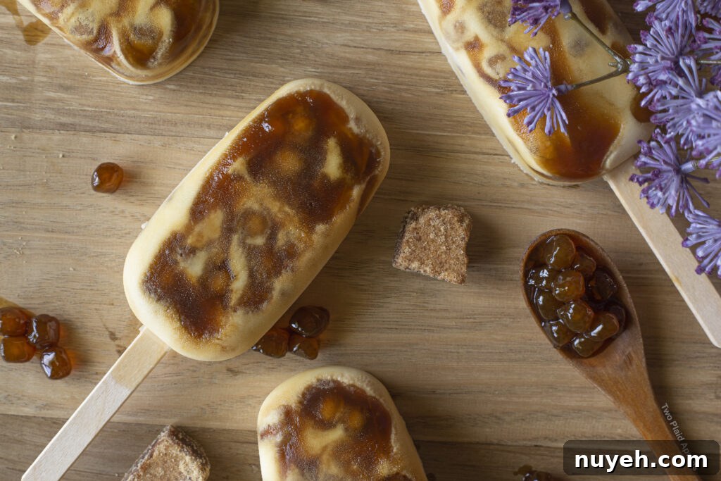 Brown sugar boba ice cream bars on a wooden board.