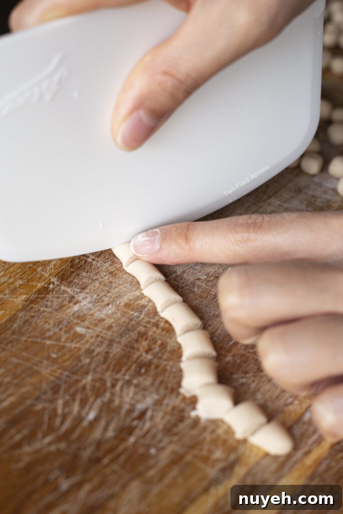 Cutting tapioca dough with bench scraper