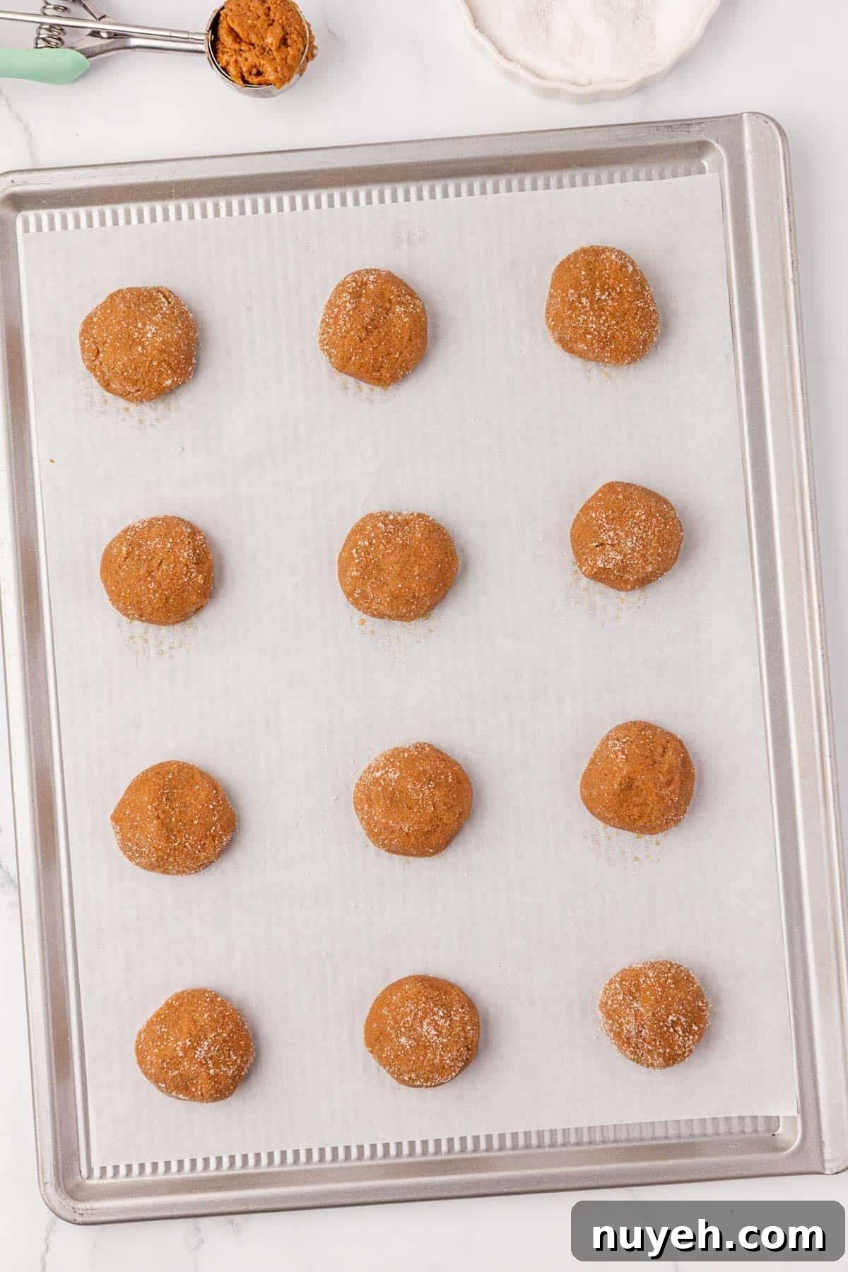Spiced Cake Mix Cookies Recipe 9 balls of cookie dough on a baking sheet