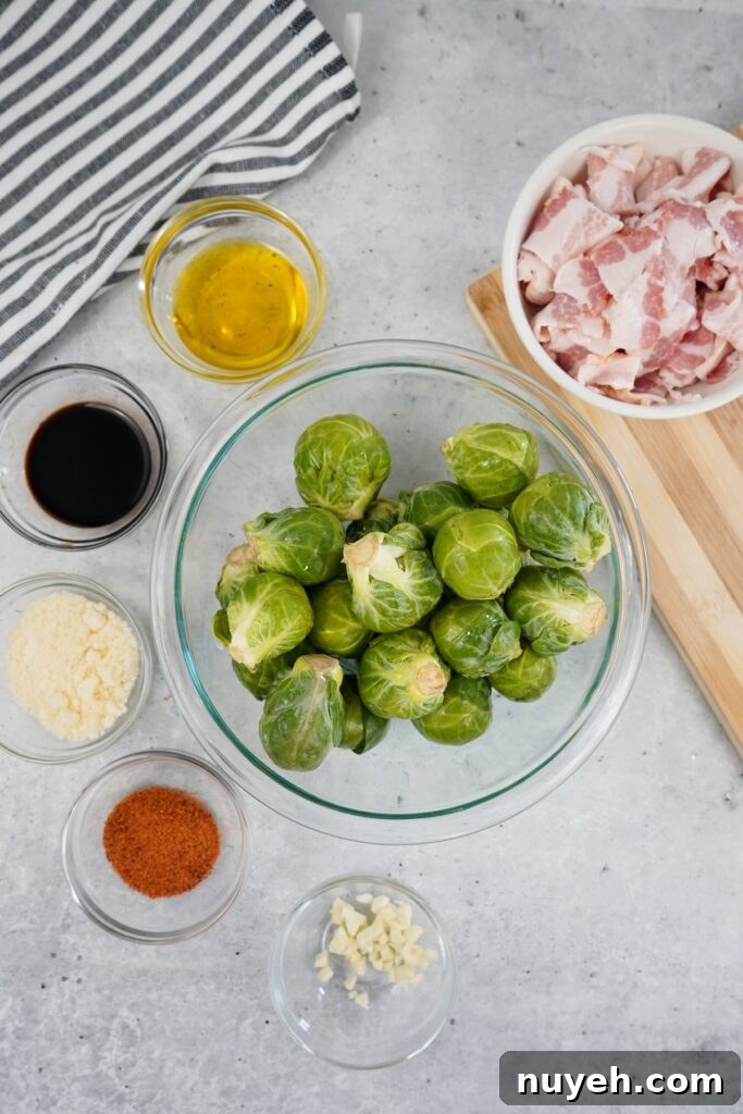 Raw halved Brussels sprouts on a cutting board