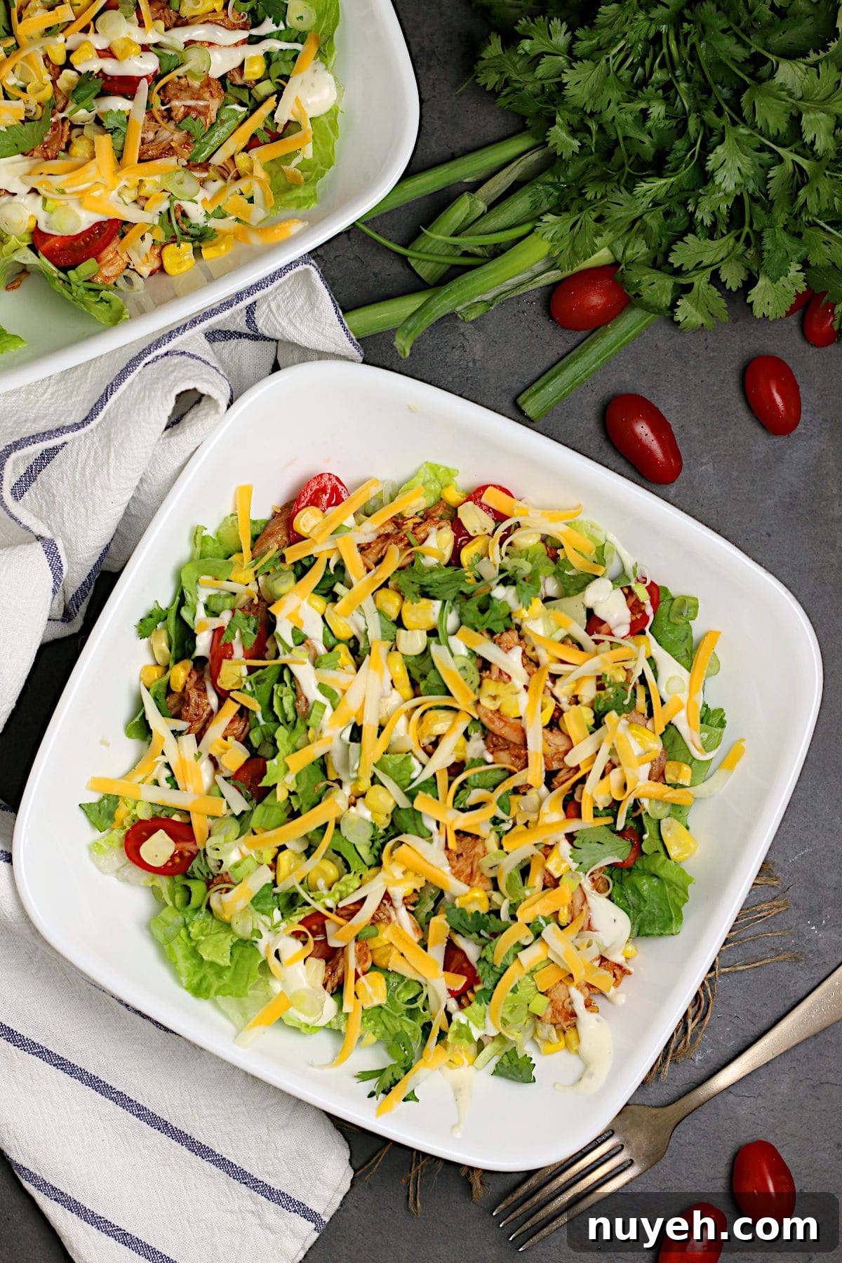 Overhead photo of Barbecue Chicken Ranch Salad in white bowls.