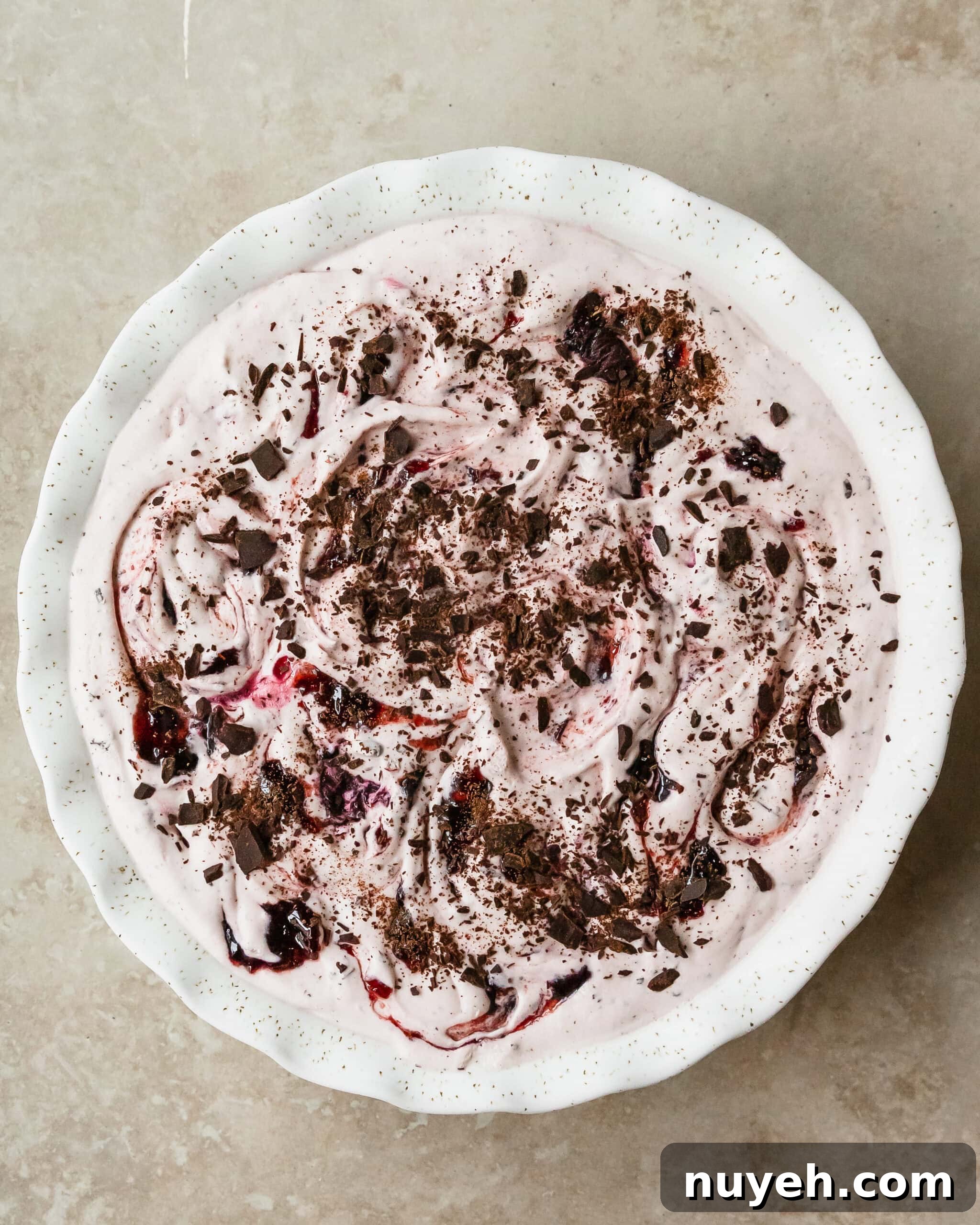Black cherry ice cream is a rich and creamy vanilla ice cream infused with sweet black cherry syrup, chunks of black cherries and chopped chocolate. This no churn cherry ice cream is an easy to make treat everyone will love.