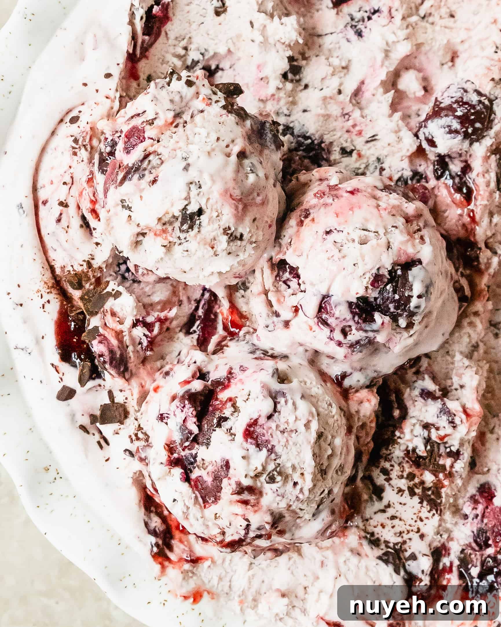 Black cherry ice cream is a rich and creamy vanilla ice cream infused with sweet black cherry syrup, chunks of black cherries and chopped chocolate. This no churn cherry ice cream is an easy to make treat everyone will love.