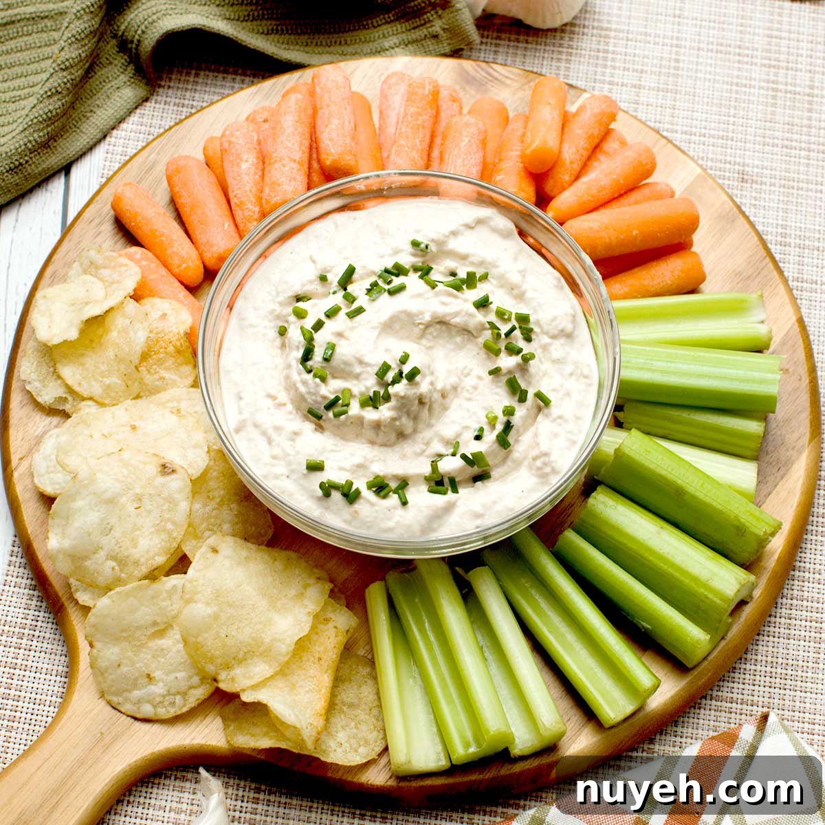 Cherry Compote in 15 Minutes: Dessert Topping Recipe 8 A bowl of french onion dip with greek yogurt surrounded by cut veggies and potato chips.