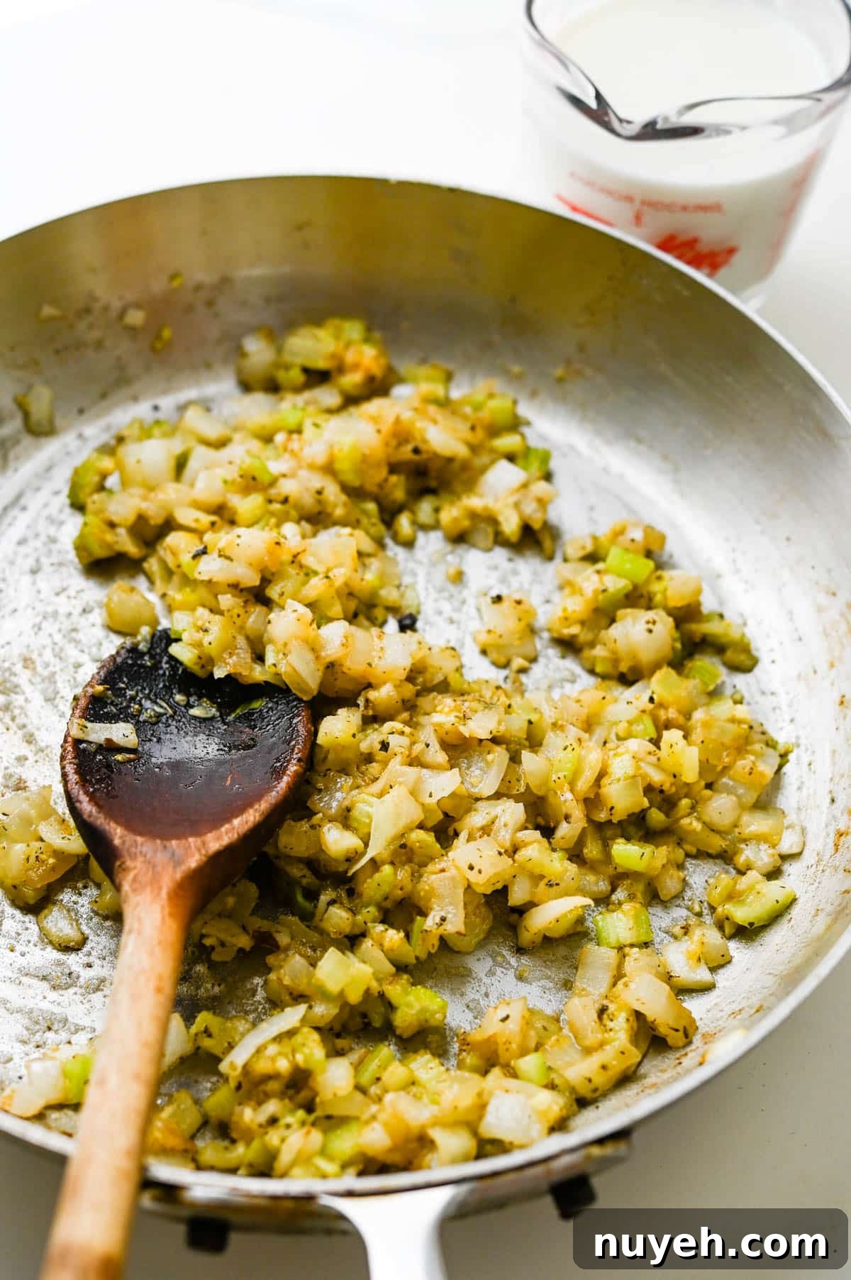 Creamy Tuna Noodle Casserole with Crispy Crumbs 5 Adding flour to the sauteed vegetables.