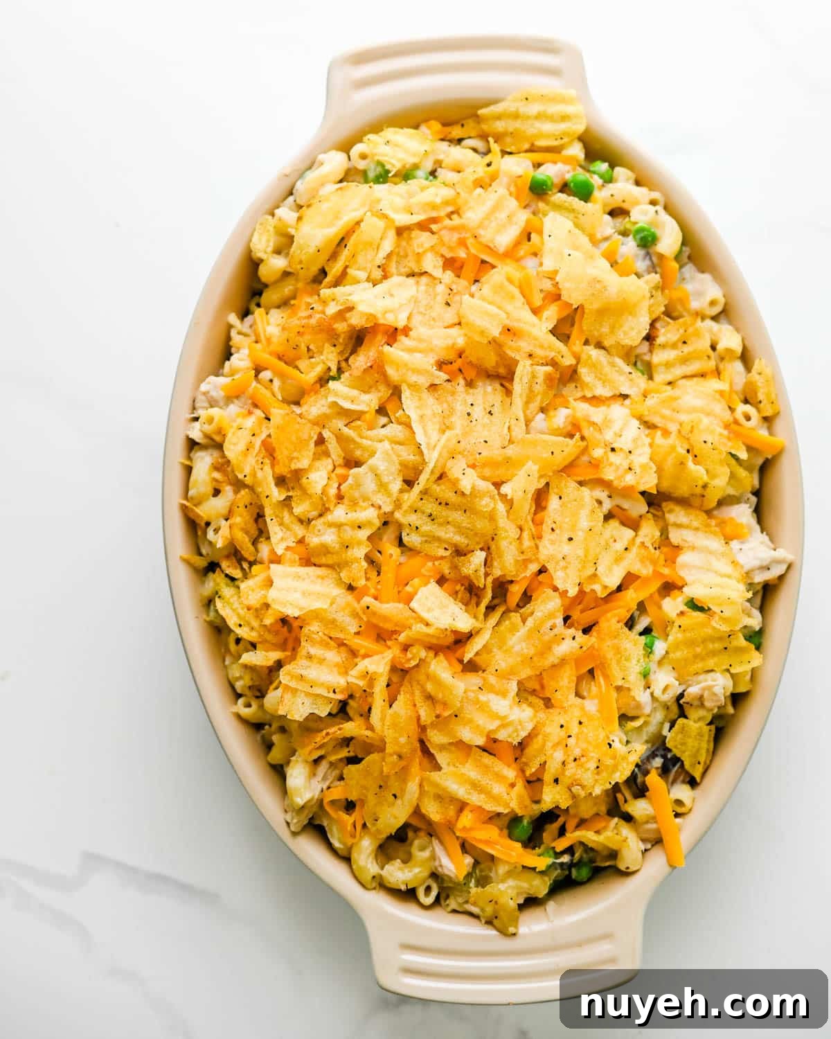 Creamy Tuna Noodle Casserole with Crispy Crumbs 10 Top the casserole with potato chips.