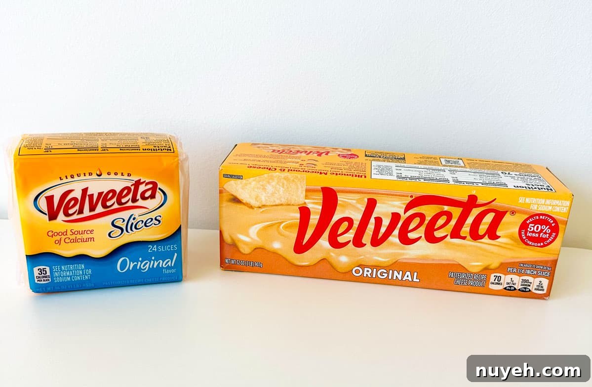 shot of velveeta original and slices on white background