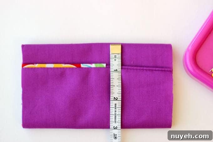 A 2 sided tissue holder pouch is perfect for cold and flu season. One side can hold a pack of tissues, the other side can hold a mini bottle of sanitizer and a lip gloss!