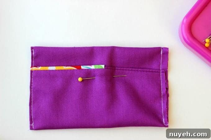 A 2 sided tissue holder pouch is perfect for cold and flu season. One side can hold a pack of tissues, the other side can hold a mini bottle of sanitizer and a lip gloss!