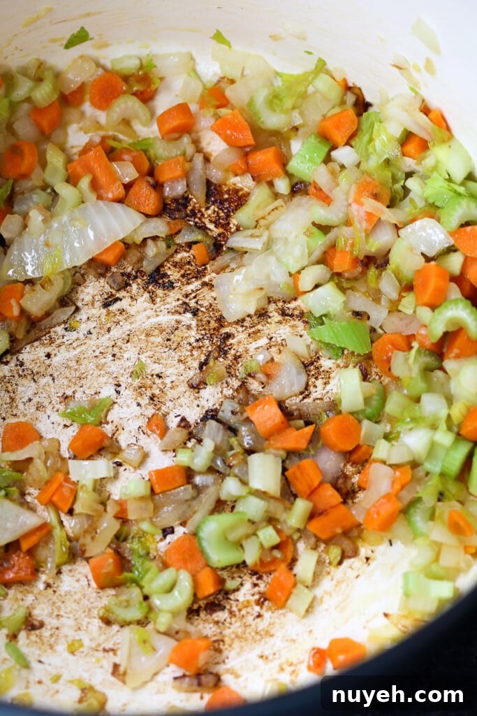 diced carrots, celery and onions in a soup pot