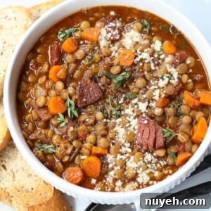 lentil soup with ham in a white bowl