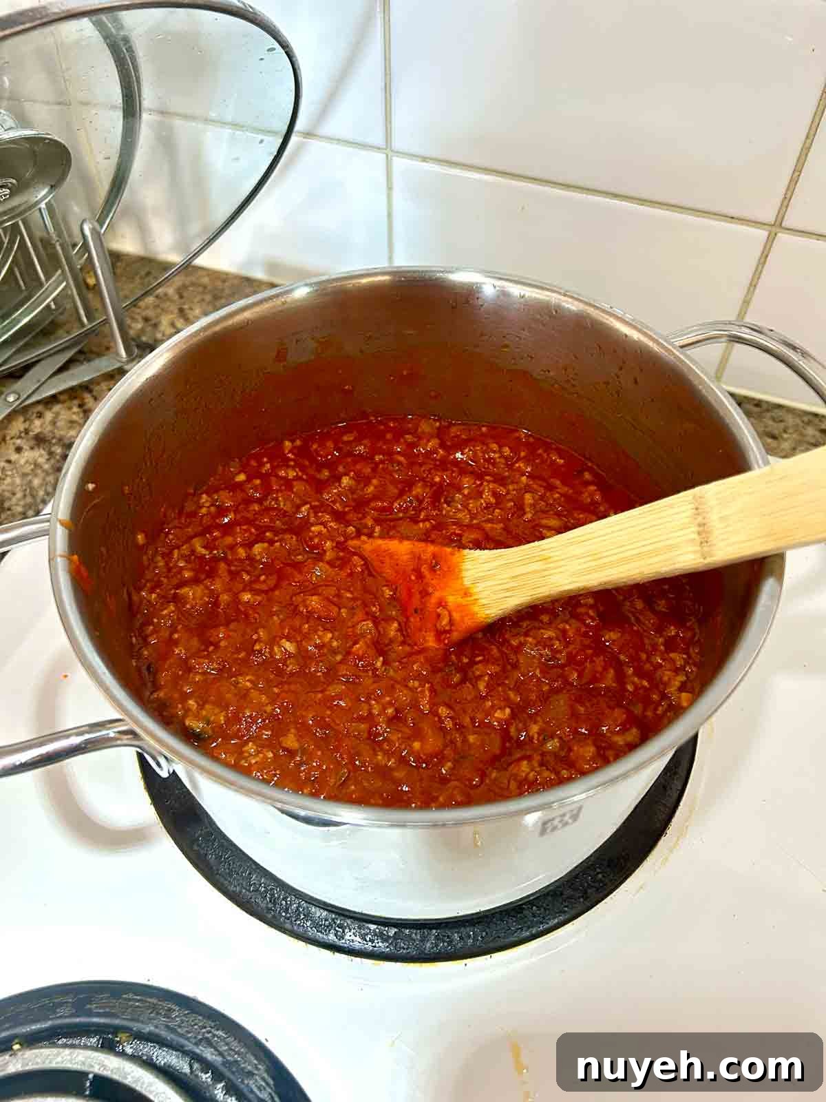 meat sauce cooking in pot.