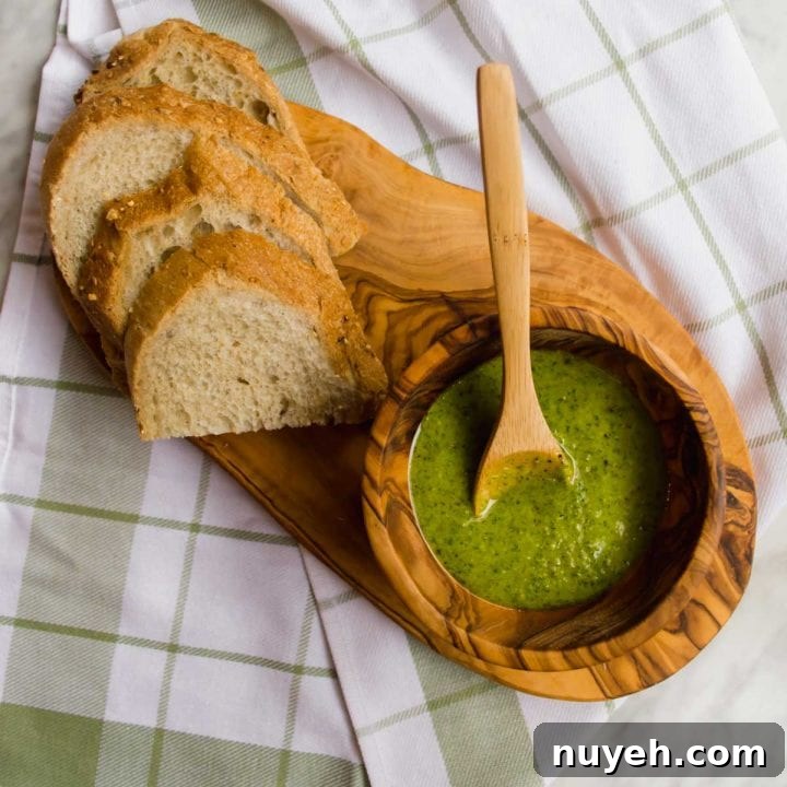 Pesto in bowl with bread flatlay.