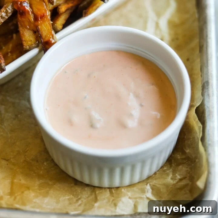 In-N-Out copycat secret spread sauce in a ramekin with animal-style French fries.